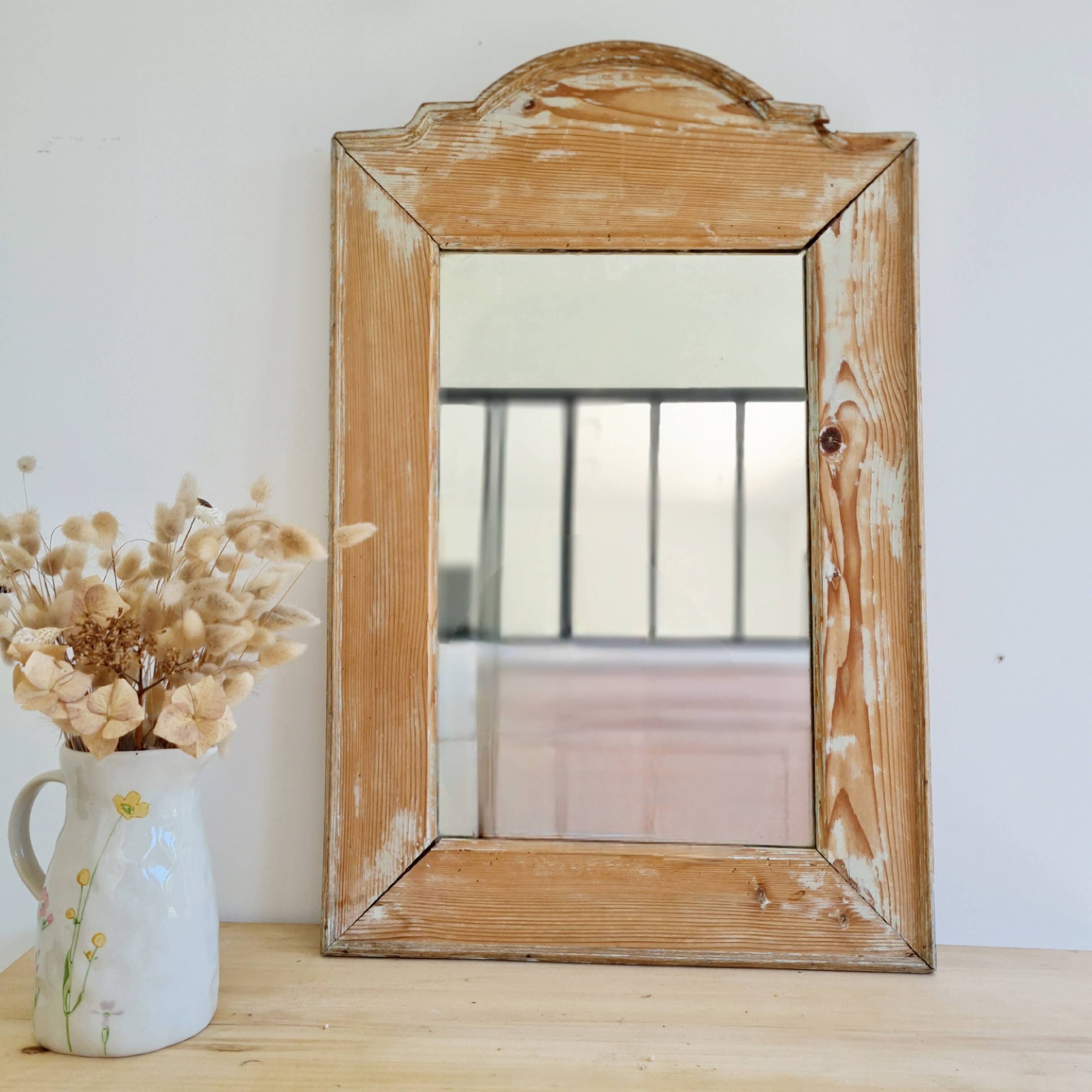 Antique mirror in raw patinated wood with pediment