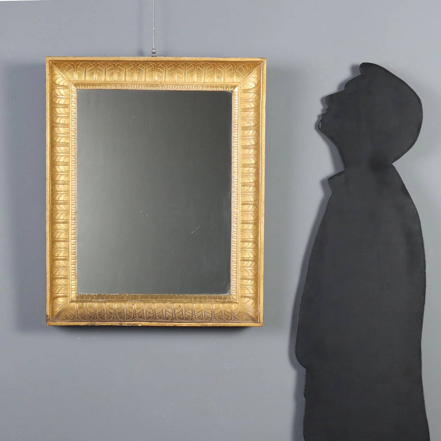 Antique Empire mirror in gilded wood, Italy, 19th century.