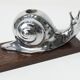Silver snail candlestick on a teak base 1960