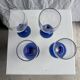 Set of 2 small king-shaped stemmed glasses and 2 small ball-shaped stemmed glasses