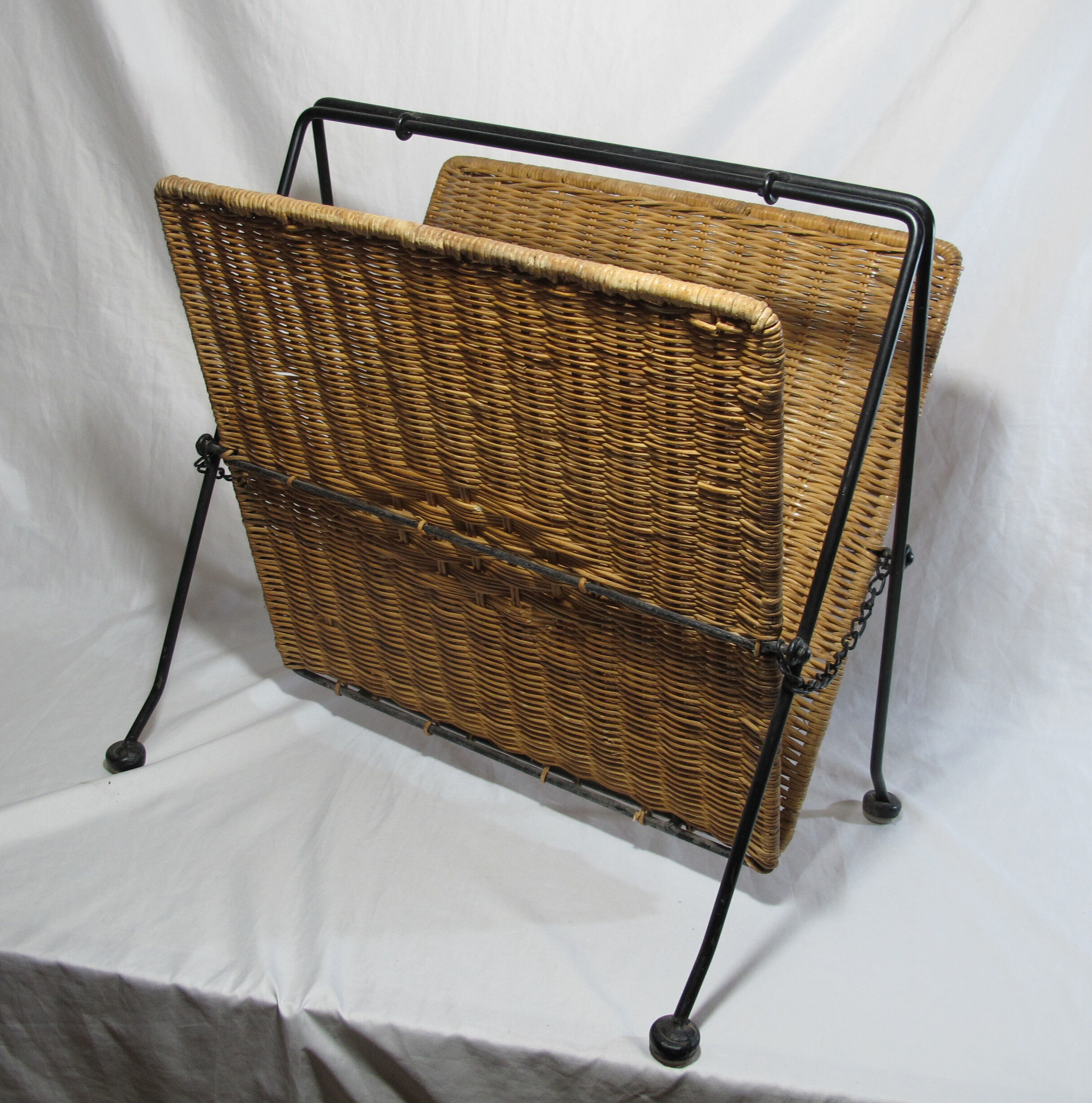 Vintage magazine rack in metal and wicker