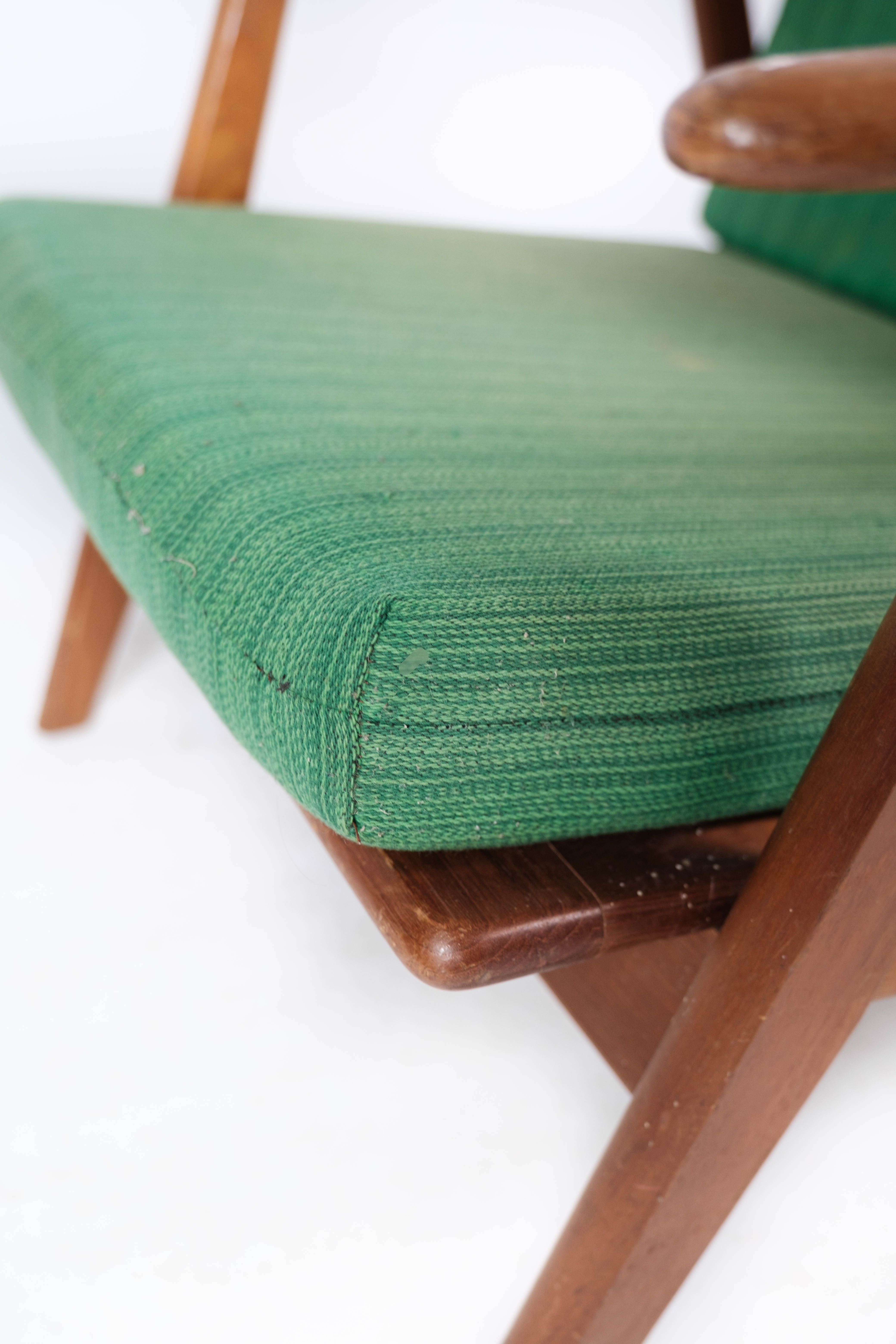 Easy chair in teak and with green upholstery of Danish design, 1960s