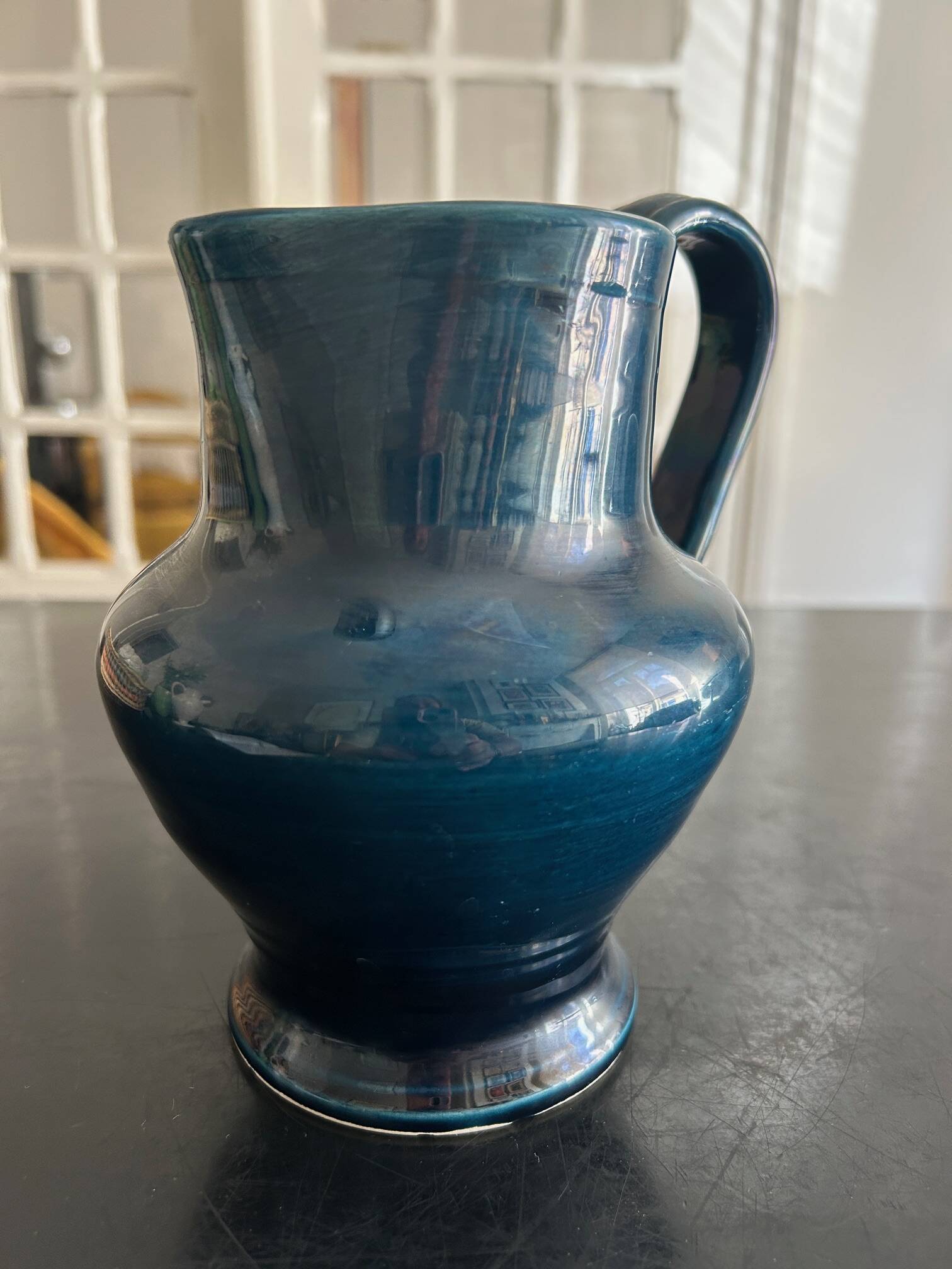 blue pitcher the potter chin