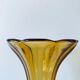 Ancient tulip vase in amber glass