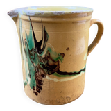 Large vintage ceramic pitcher with abstract green and brown decoration.