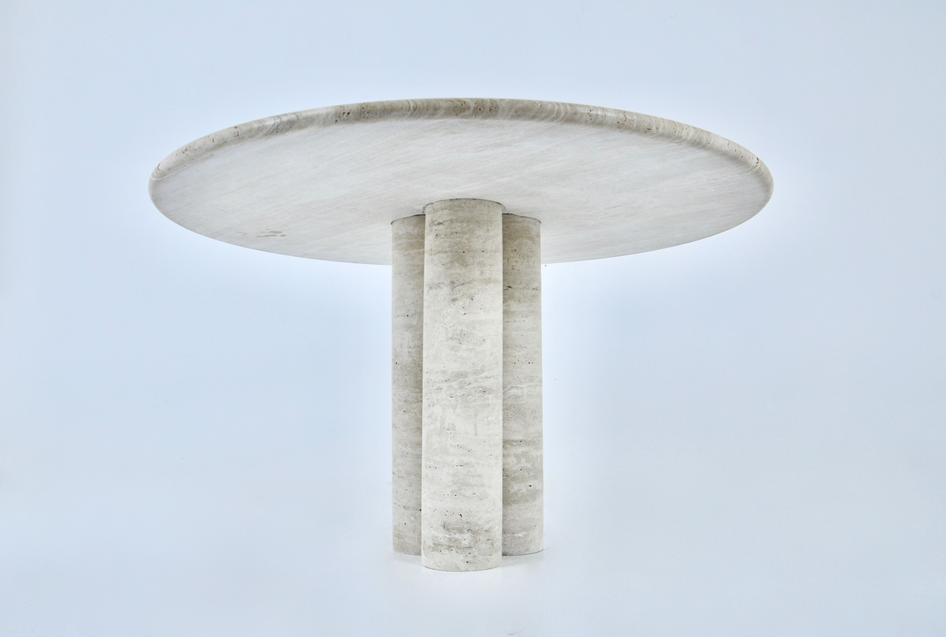 Circular travertine dining table