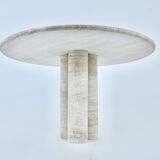 Circular travertine dining table