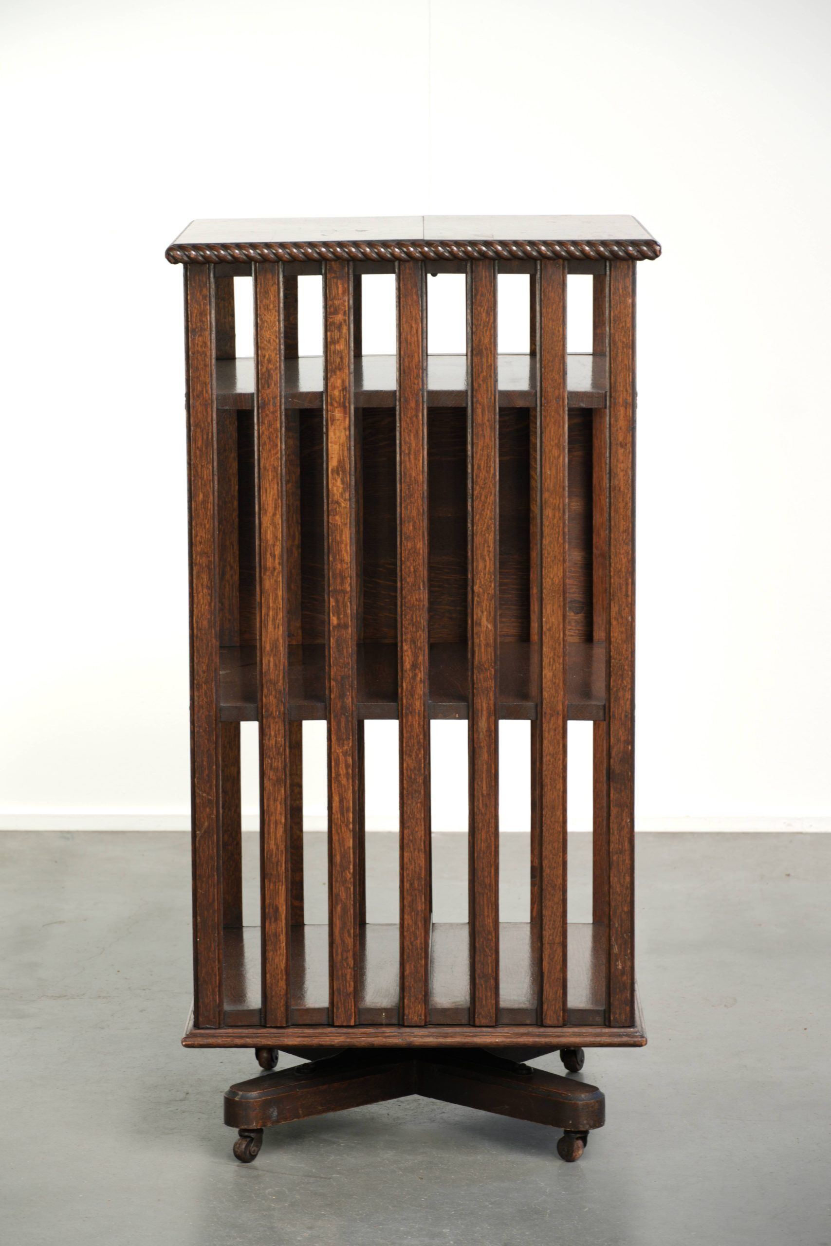 Large antique English oak book carousel from the 19th century
