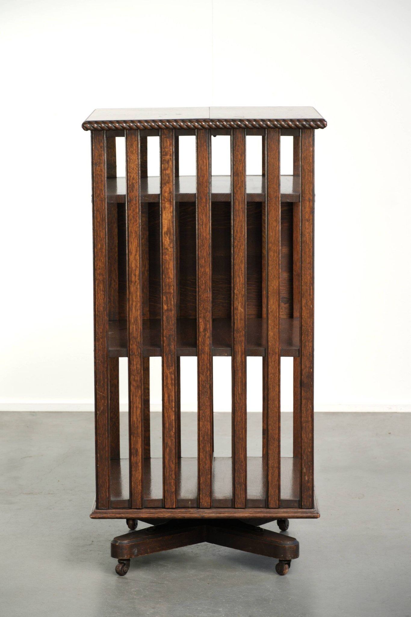 Large antique English oak book carousel from the 19th century