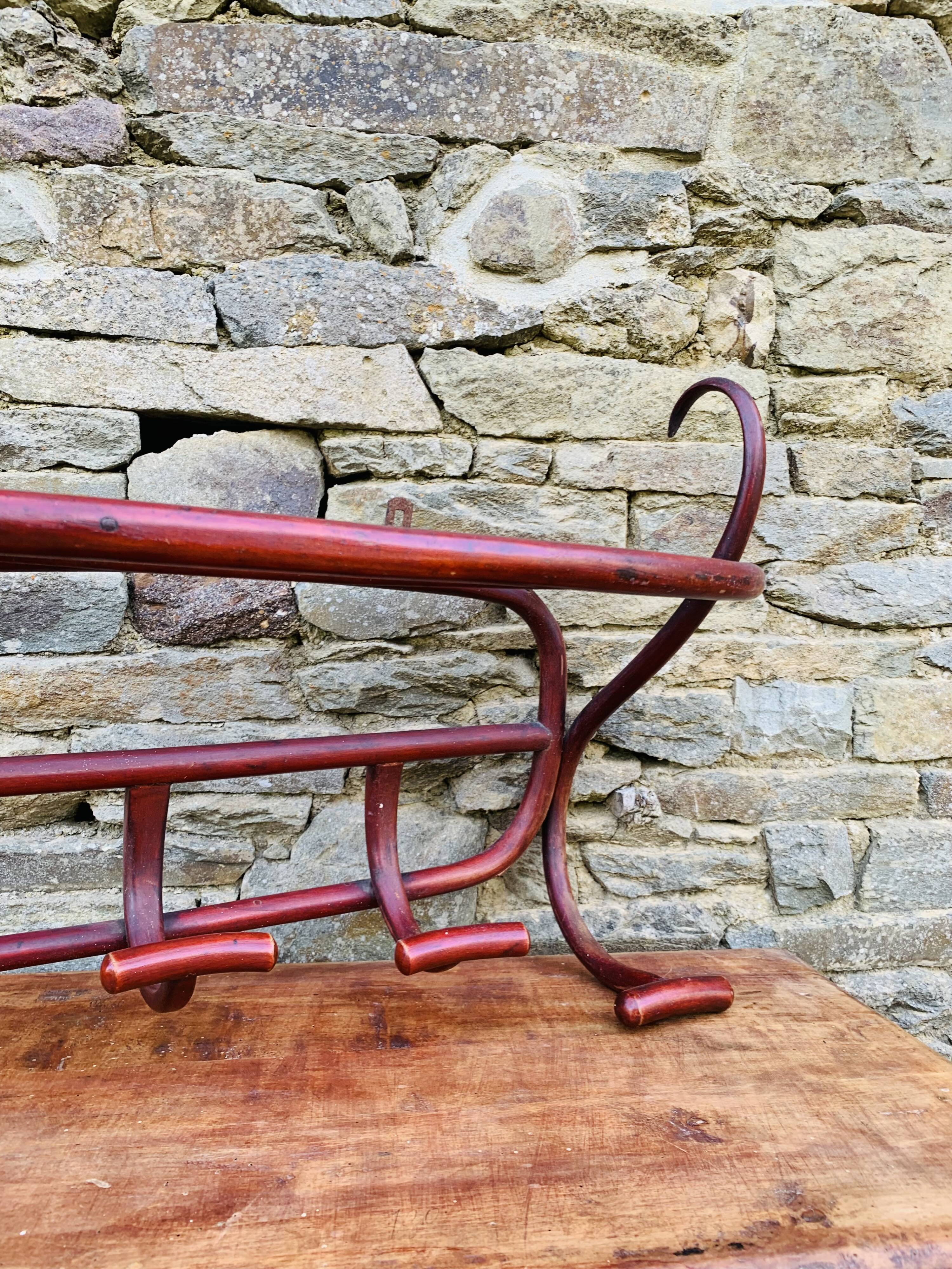 Antique curved wooden wall coat rack