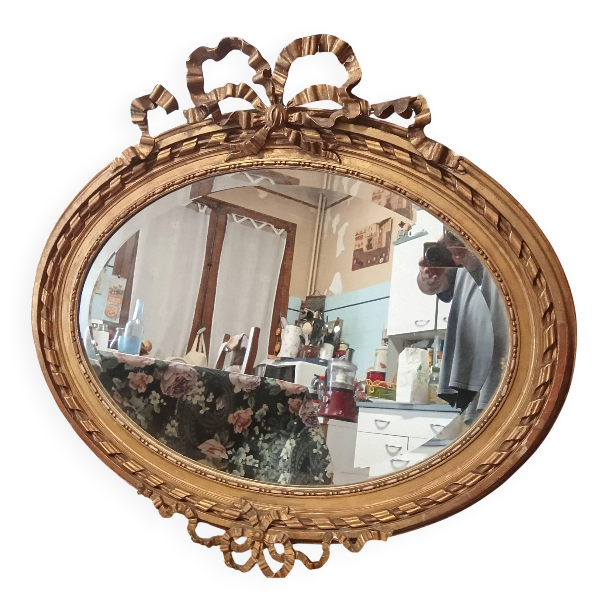 Golden leaf medallion mirror.