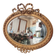 Golden leaf medallion mirror.