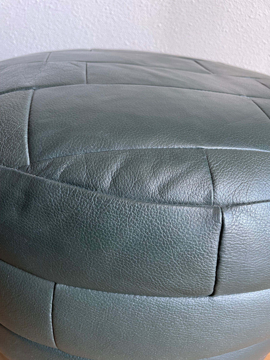 Green patchwork leather pouf from Sède