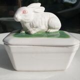Pot terrine rabbit of Bavent in white earthenware on square of greenery