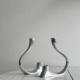 Pair of designer candlesticks in chromed metal