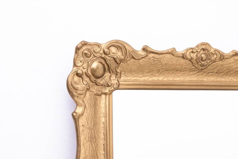 Mirror in a decorative gold frame