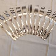Silver cutlery set for 36 place settings and its ladle.