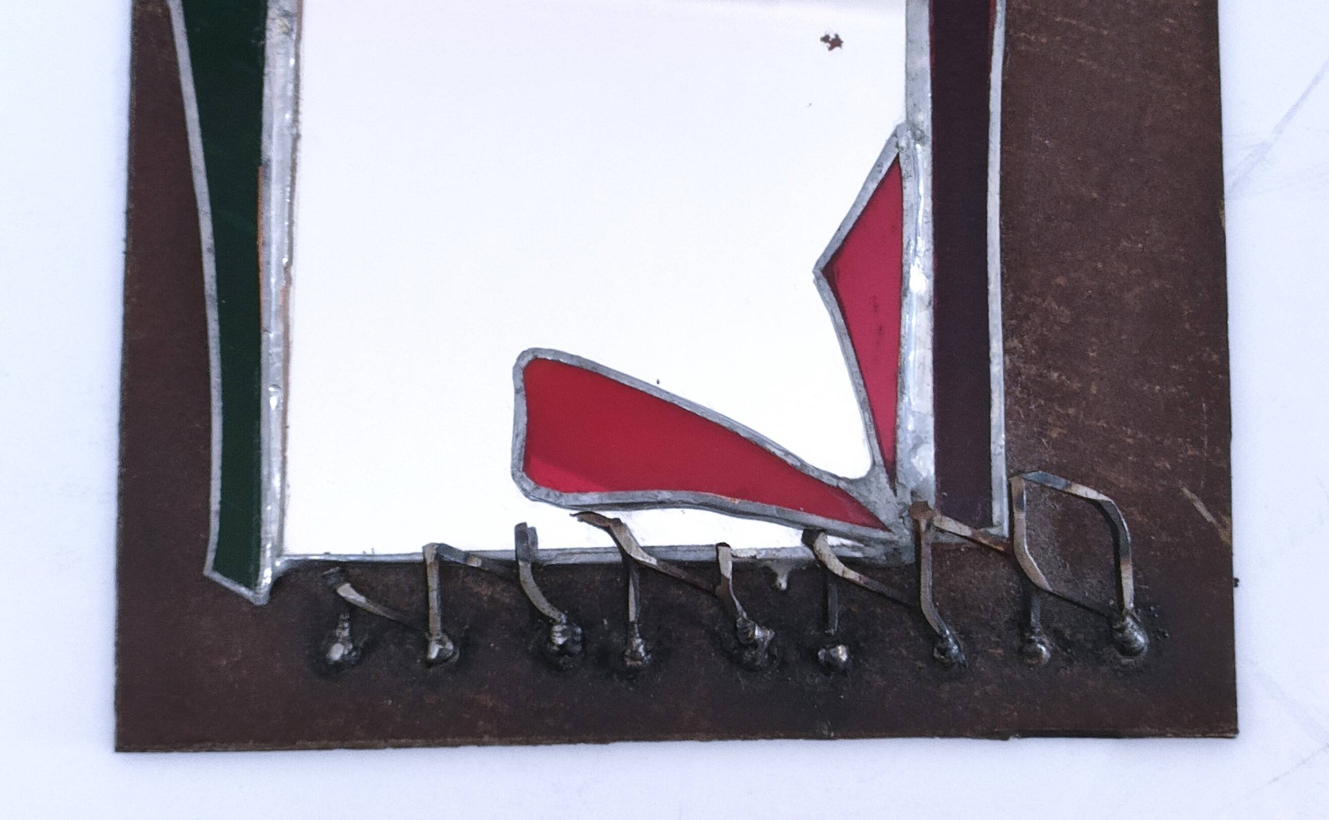 Brutalist mirror in metal and set glass