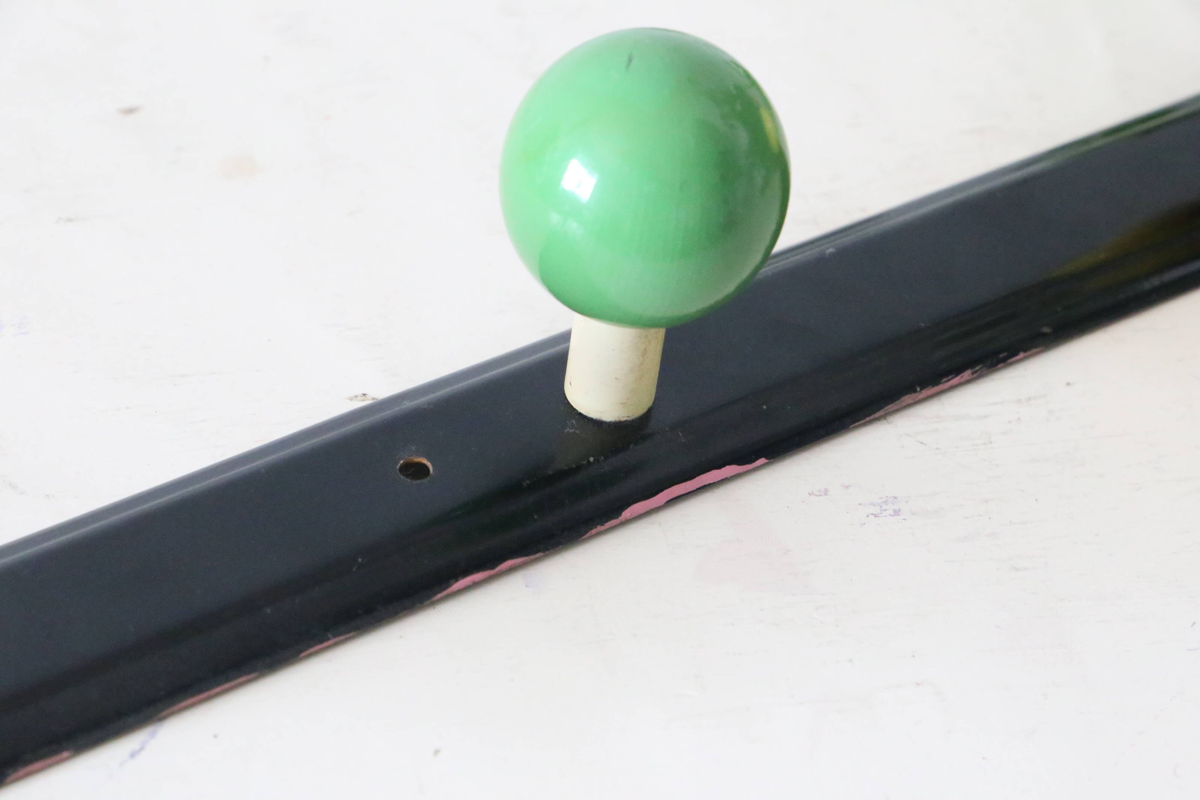 Wall-mounted coat rack, metal and colored wooden hook, 1960