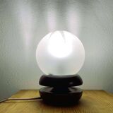 Small black wooden table lamp with frosted glass globe
