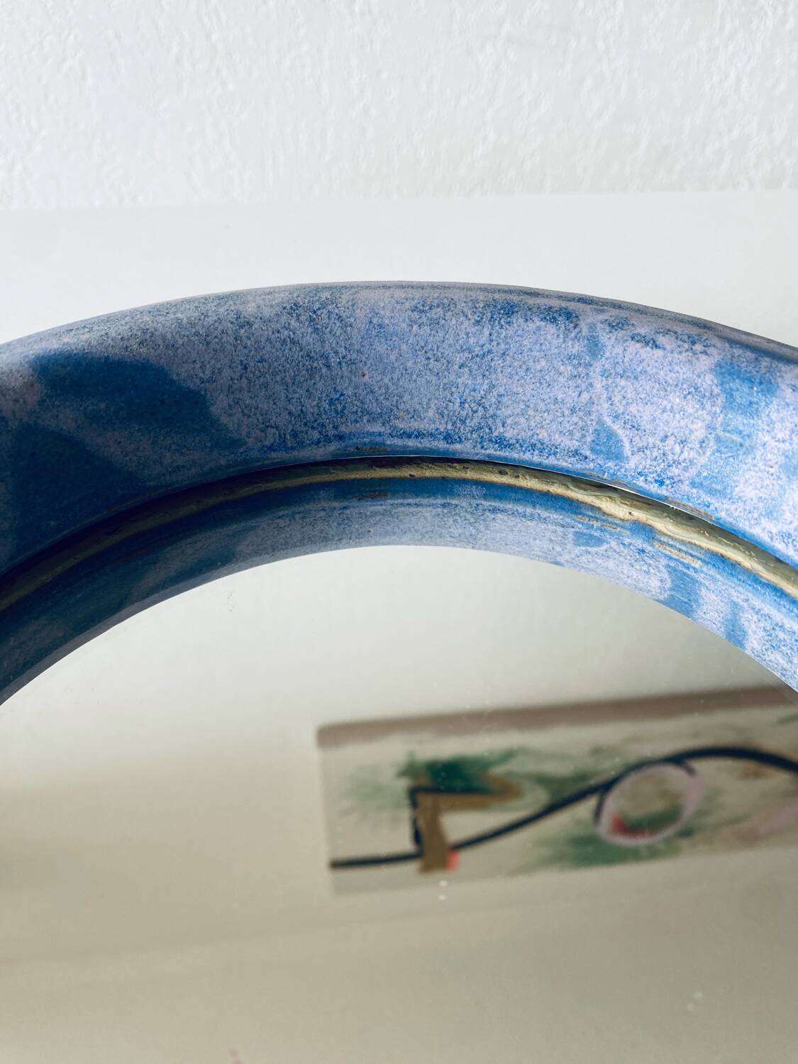 Round ceramic wall mirror