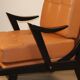 Paire de fauteuils vintage années 50 en bois noir et cuir caramel