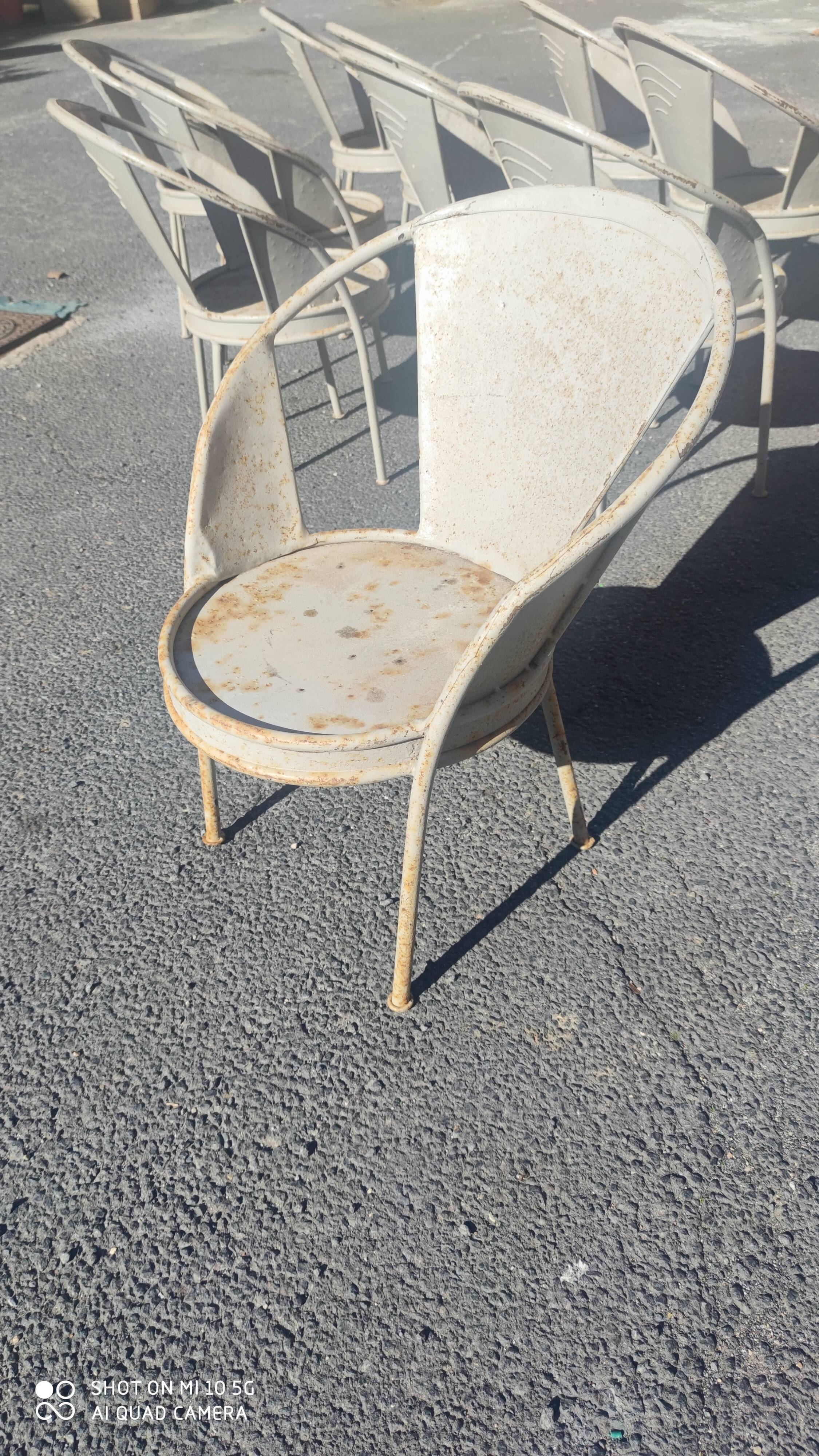 Series of 10 garden chairs made of steel garden patina