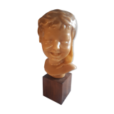 Child's head in wax on wooden base