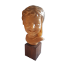Child's head in wax on wooden base