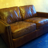 Patinated brown stitched leather 2 seater sofa with brass studs