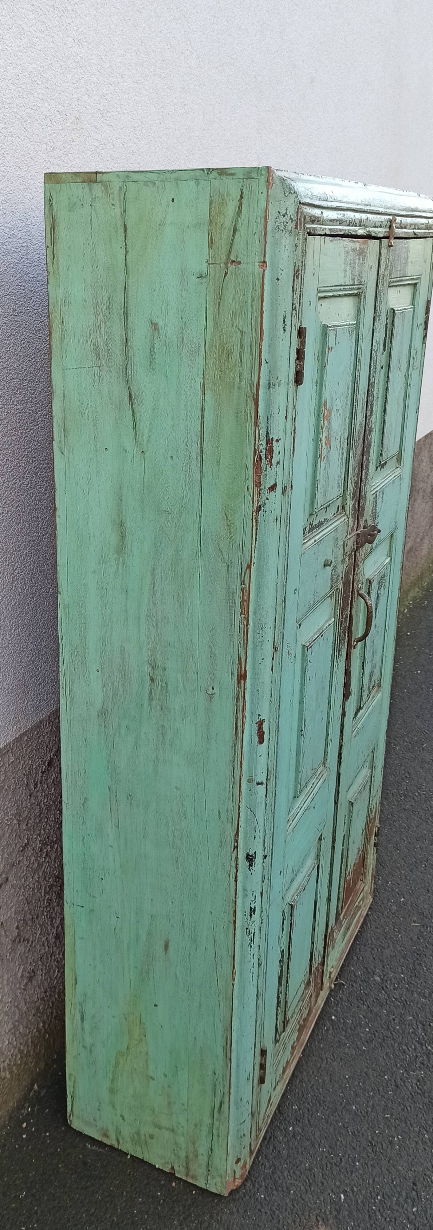 Old wooden cabinet with beautiful green patina