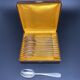 Dessert spoons in silver-white metal