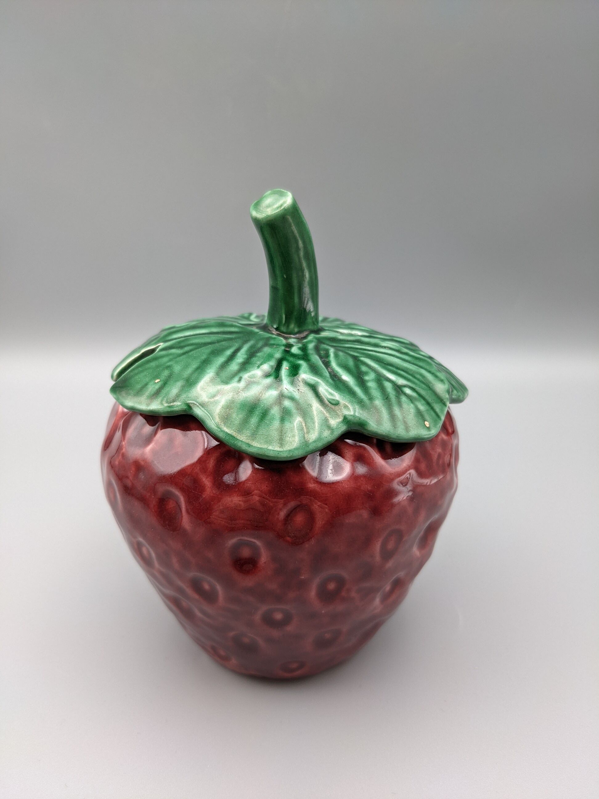 Condiment jar mustard jam in the shape of strawberry