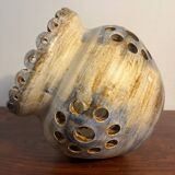 Ceramic suspension with openings