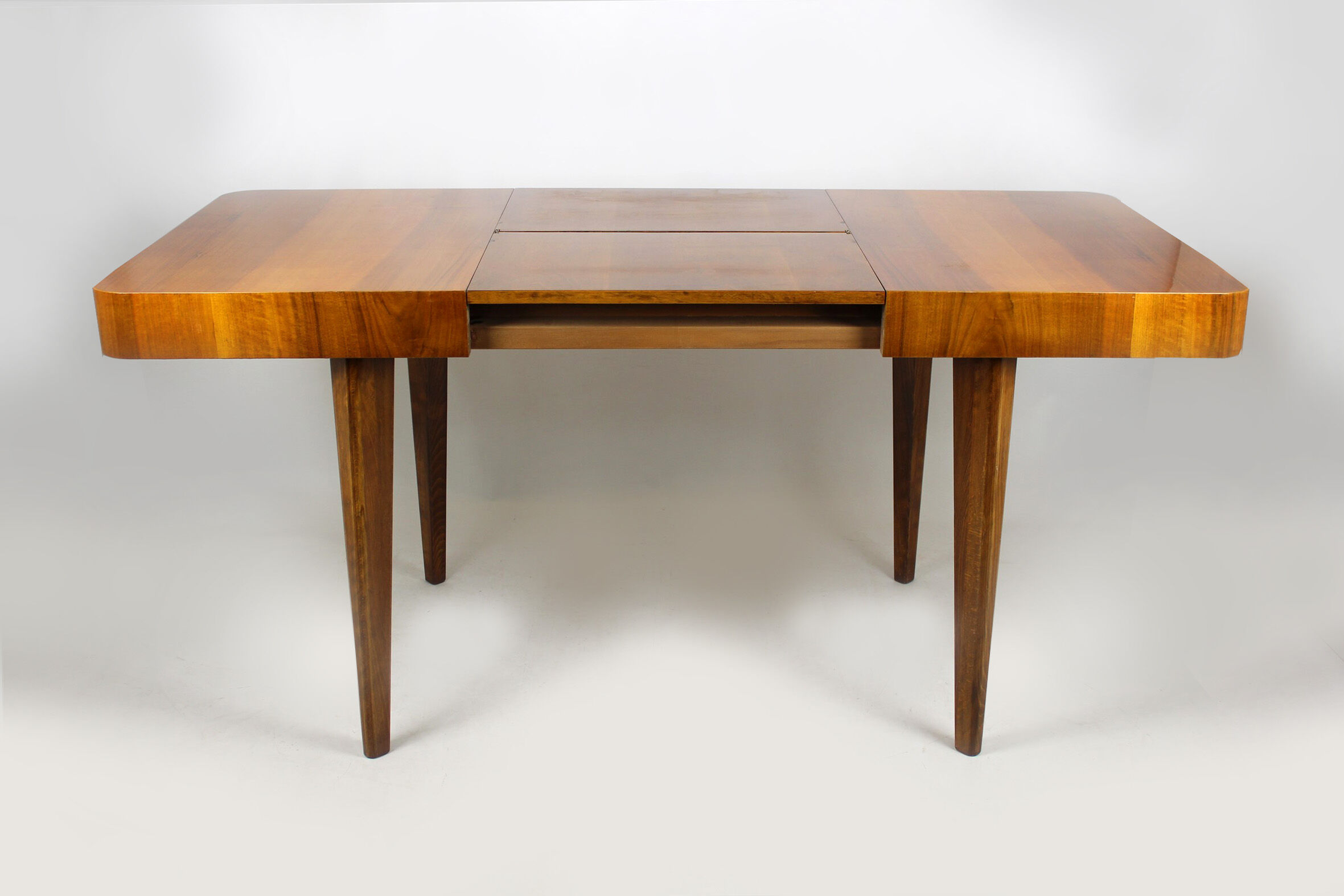 Walnut folding dining table by Jindrich Halabala for UP Zavody, 1940s
