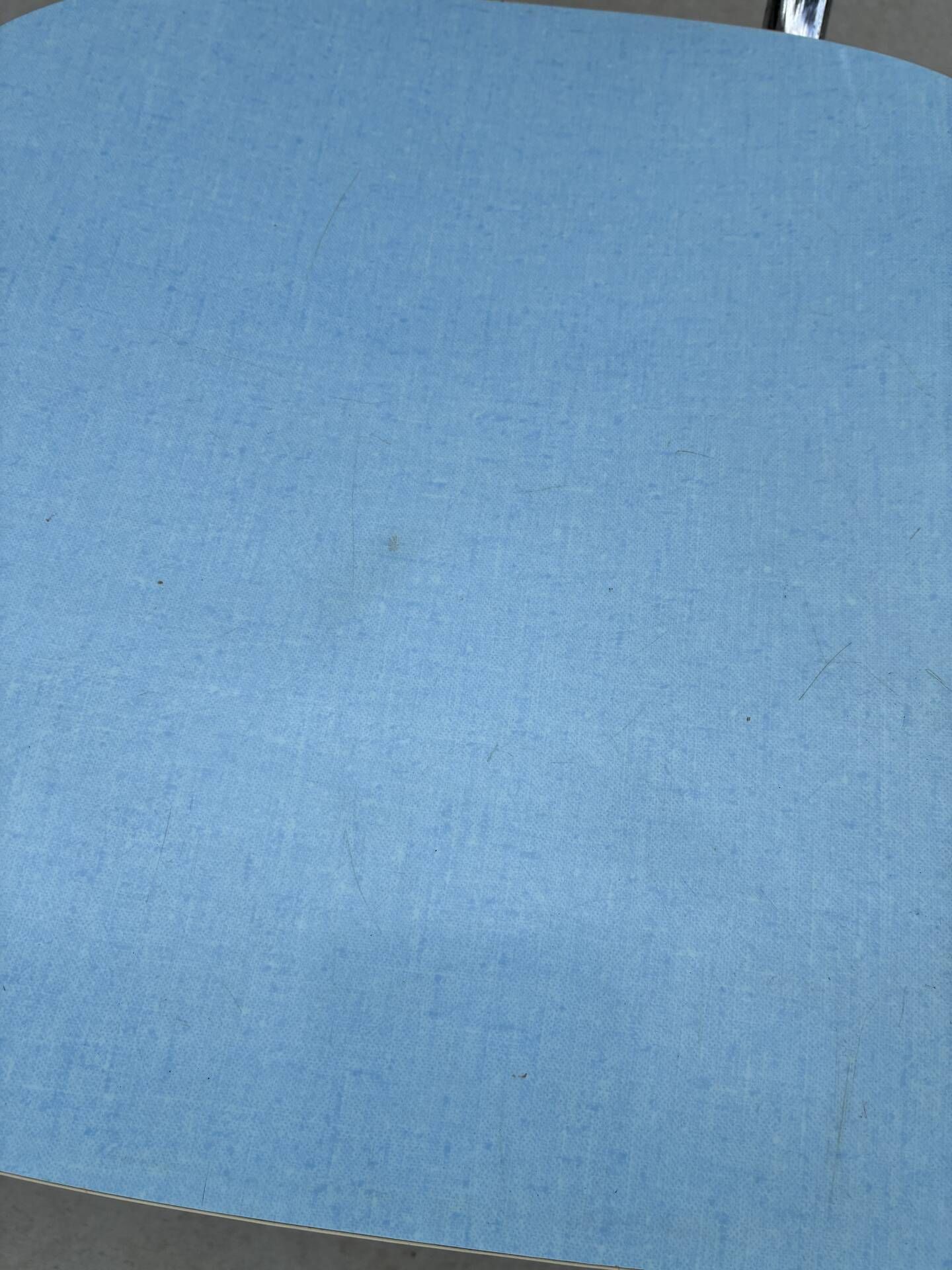 Two blue Formica "Peugeot" chairs.