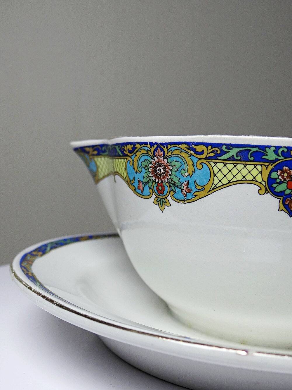 Old Luneville sauce boat, opaque porcelain with polychrome decoration.