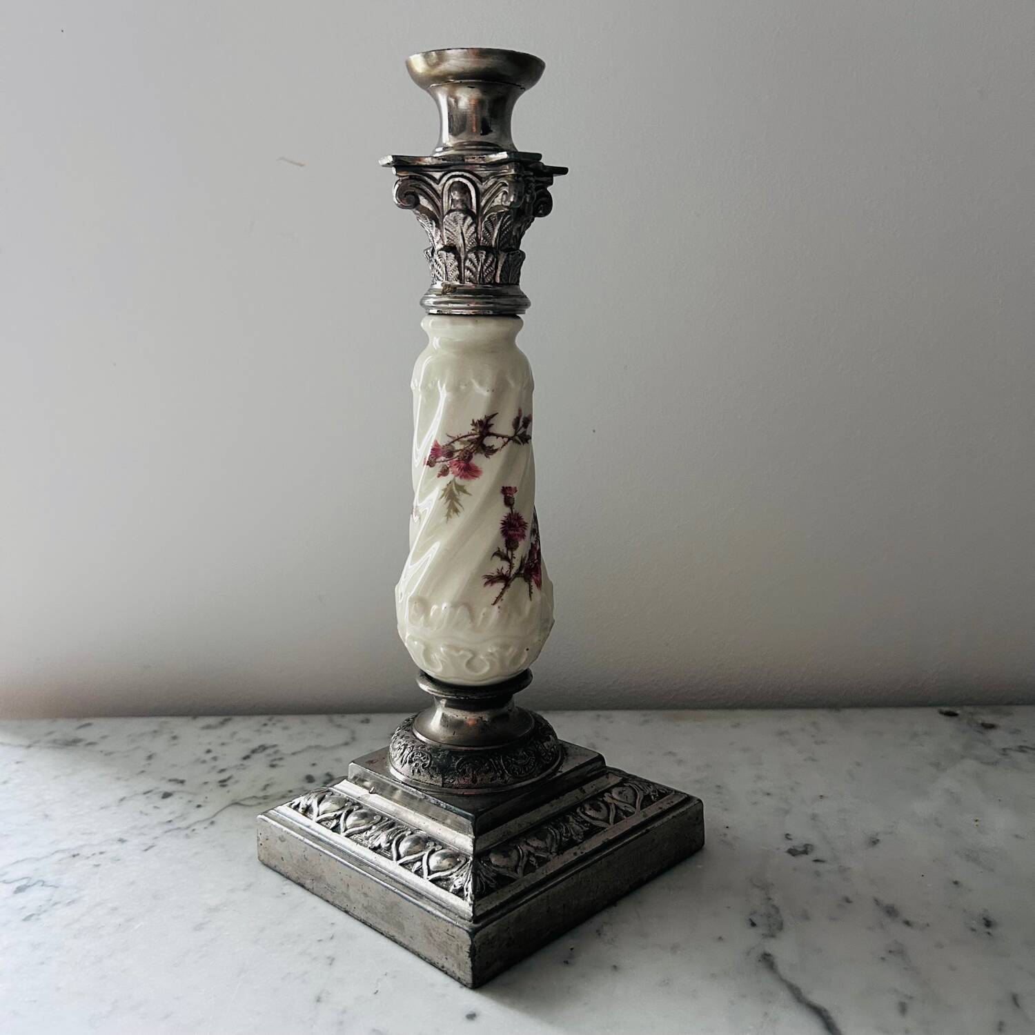 Silver-plated metal and porcelain candlestick