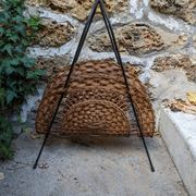 Vintage metal and wicker magazine rack, bohemian country decor.