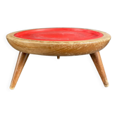 Wooden and red plastic compasses plant stand.