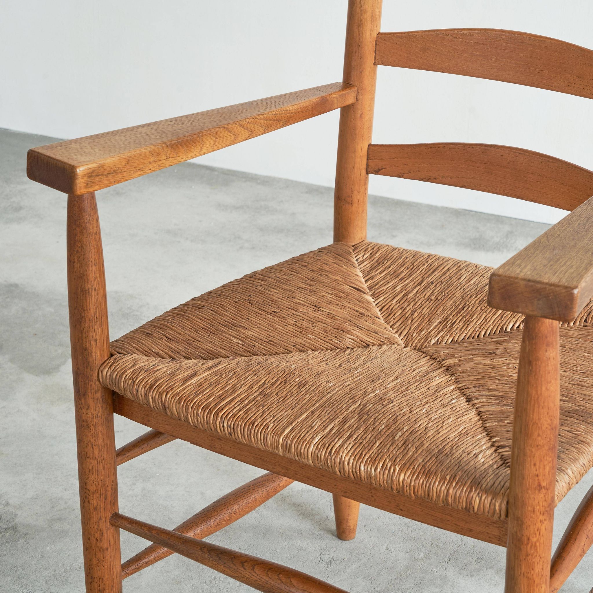 Set of 2 oak and wicker armchairs, mid-20th century.