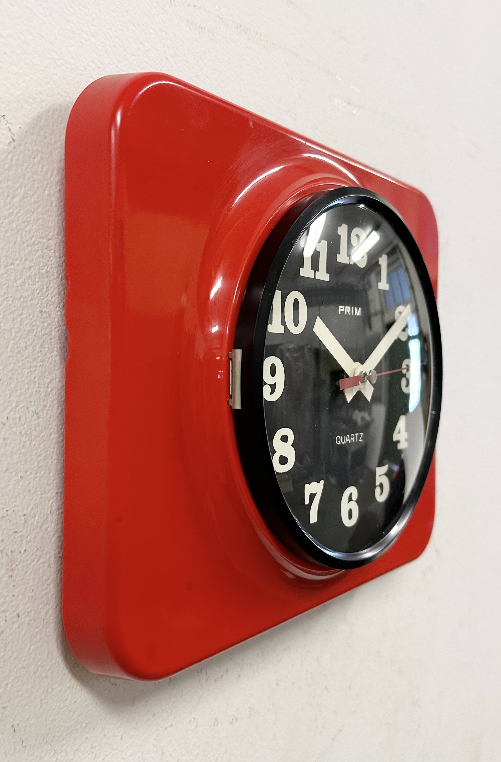 Vintage red bakelite wall clock from prim, 1970s