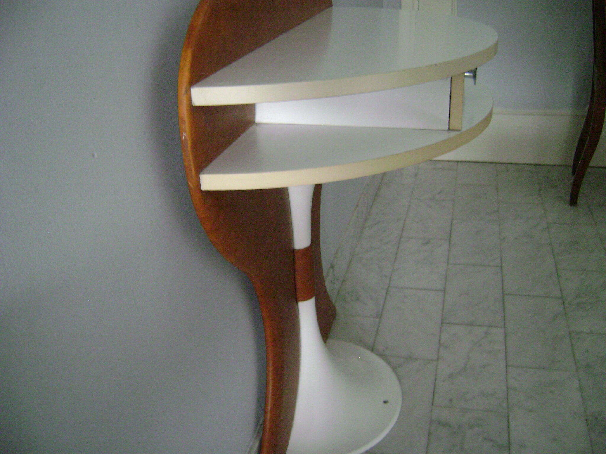 White lasked wood console and 1980s skai background