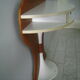 White lasked wood console and 1980s skai background