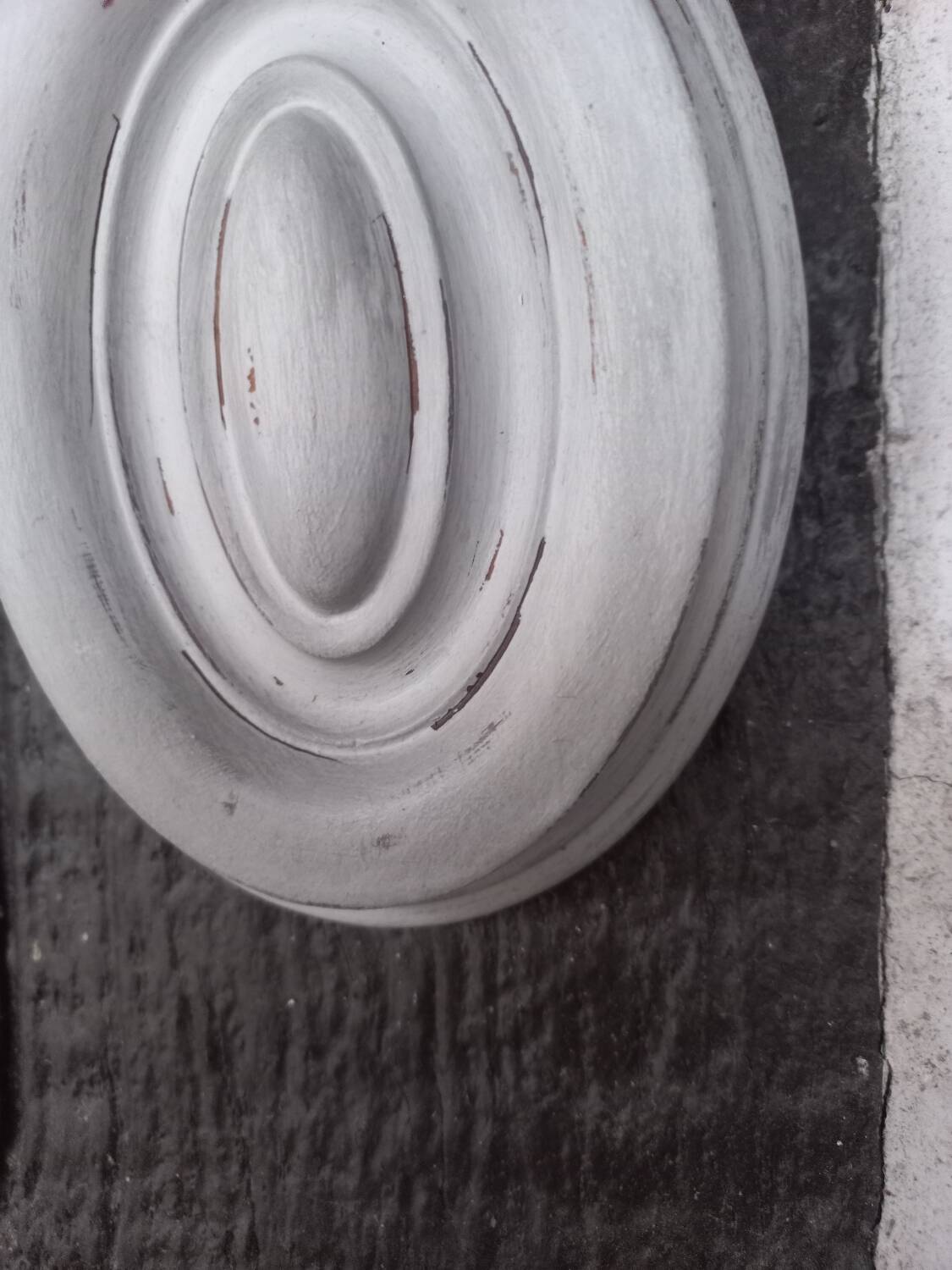 Pair of patinated oval woodwork