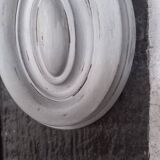 Pair of patinated oval woodwork