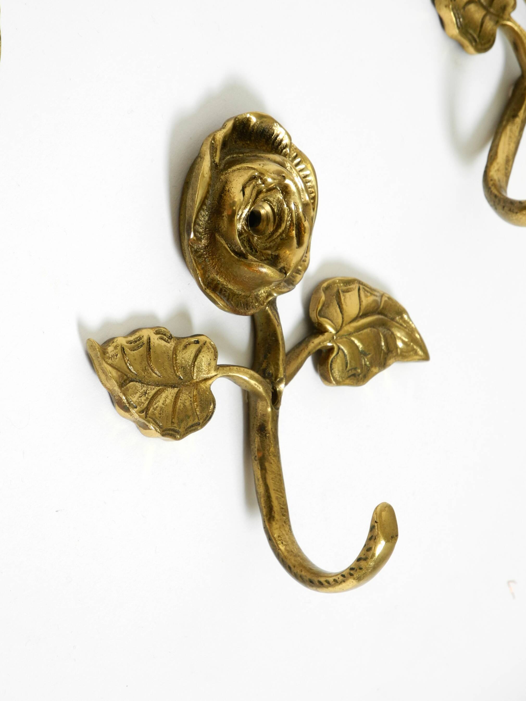 Set of five beautiful, solid mid-century brass rose wall coat hooks