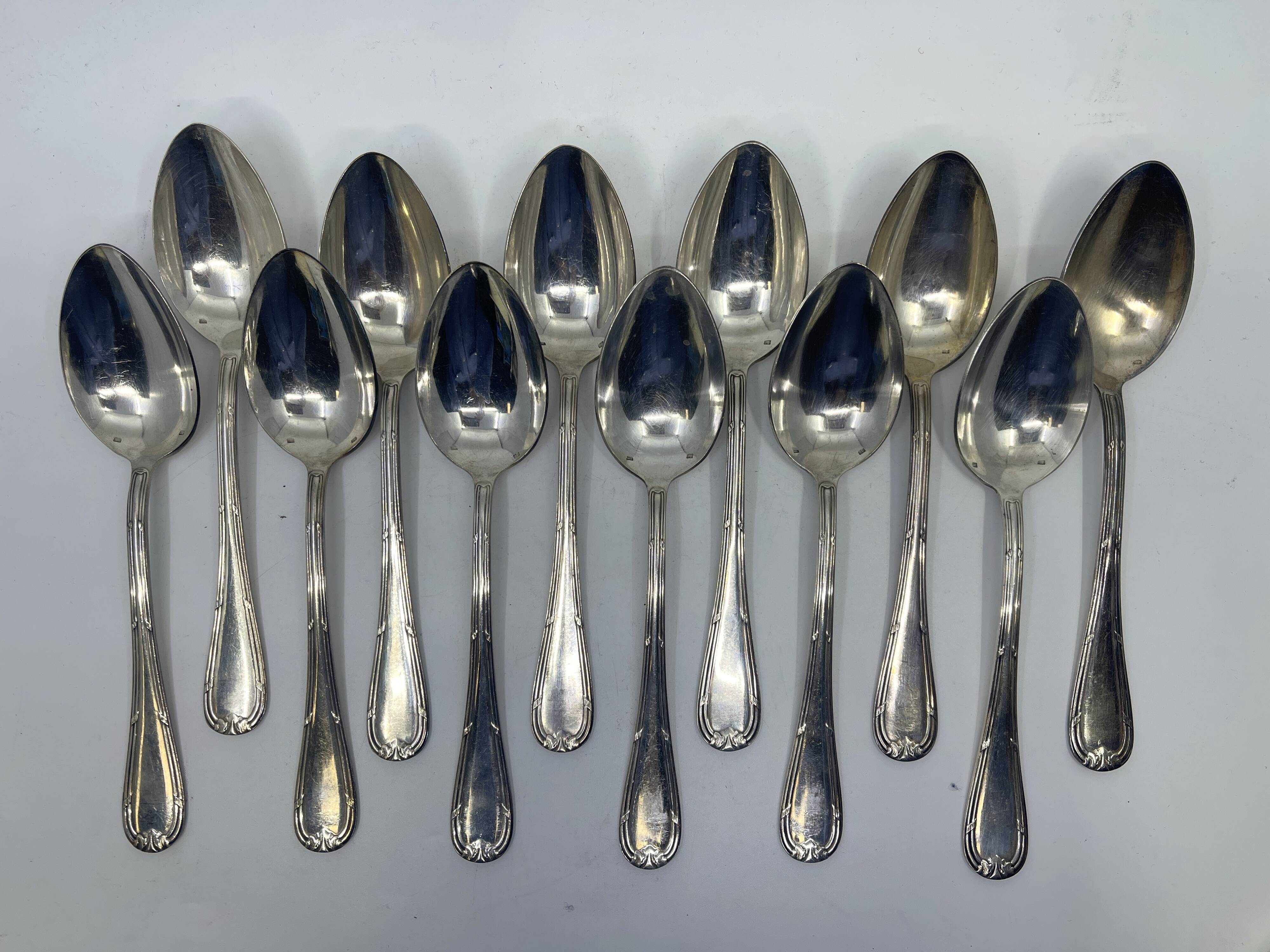 Set of 12 soup spoons and 6 silver-plated lunch forks.