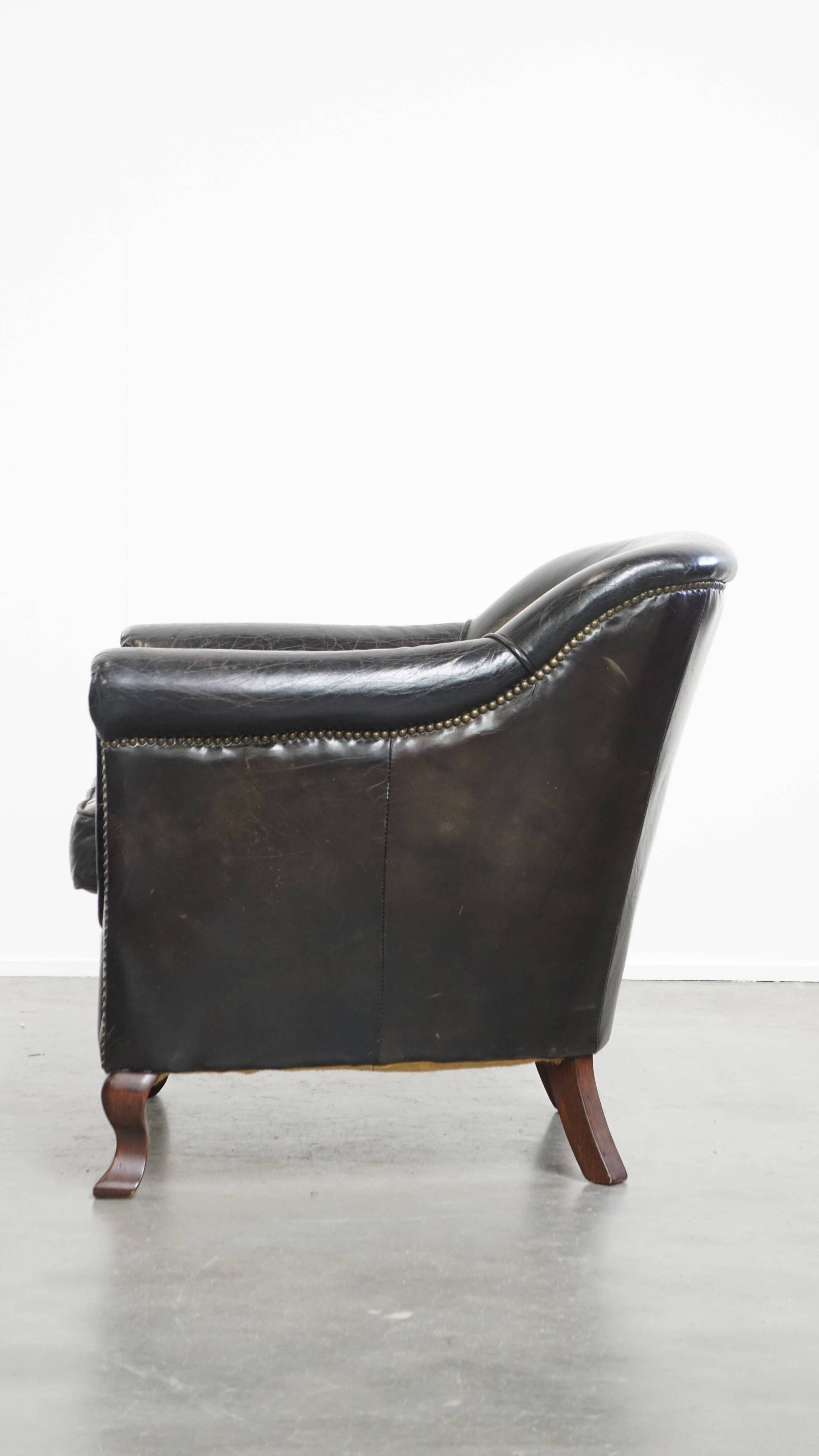 Black cowhide leather armchair