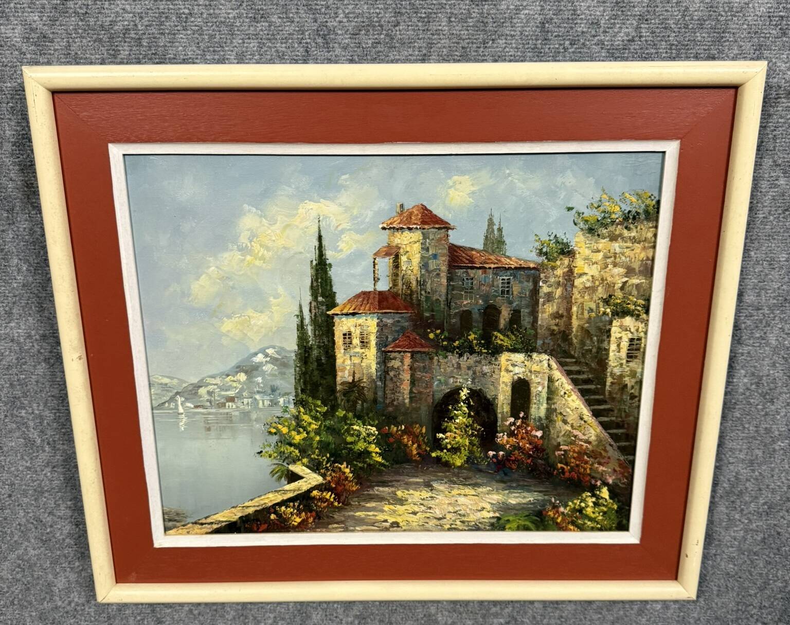 Italian School: painting of a castle on the edge of a lake